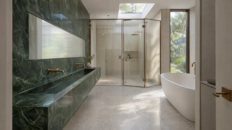 verde stone bathroom design concept: Green quartzite, fluted glass, bronze and warm grey